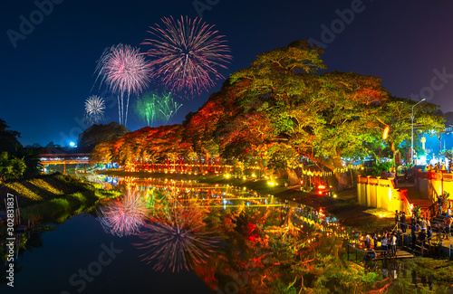 LAMPHUN, THAILAND - NOVEMBER 10, 2019 : Symphony of Lights is the spectacular light and sound show at City Wall beside the river near Wat Phra That Hariphunchai Temple for celebration in Loy Krathong 