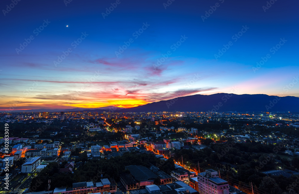 Twilight sky after sunset over city lights of Chiang Mai , Thailand.