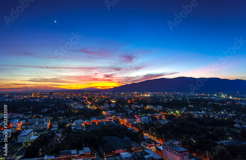 Twilight sky after sunset over city lights of Chiang Mai , Thailand.