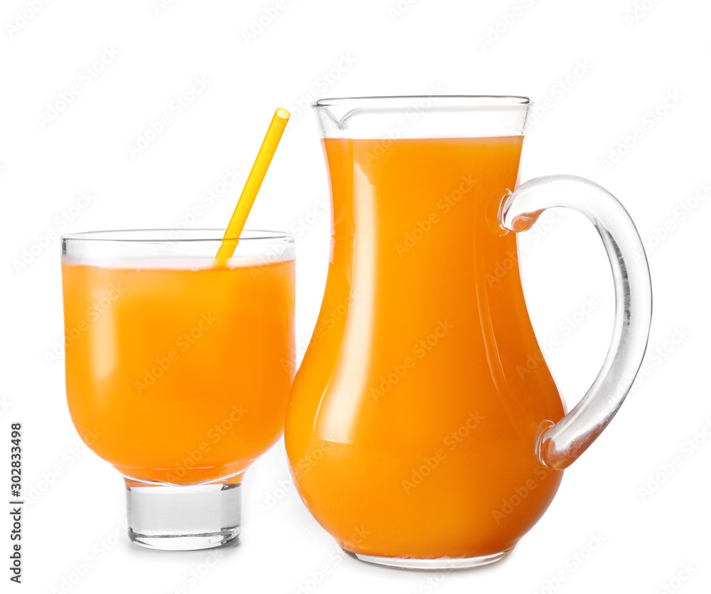 Glass and jug of fresh orange juice on white background Glass and jug of fresh orange juice on white background