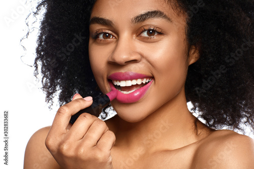 Portrait of beautiful African-American woman with bright lipstick on white background photo