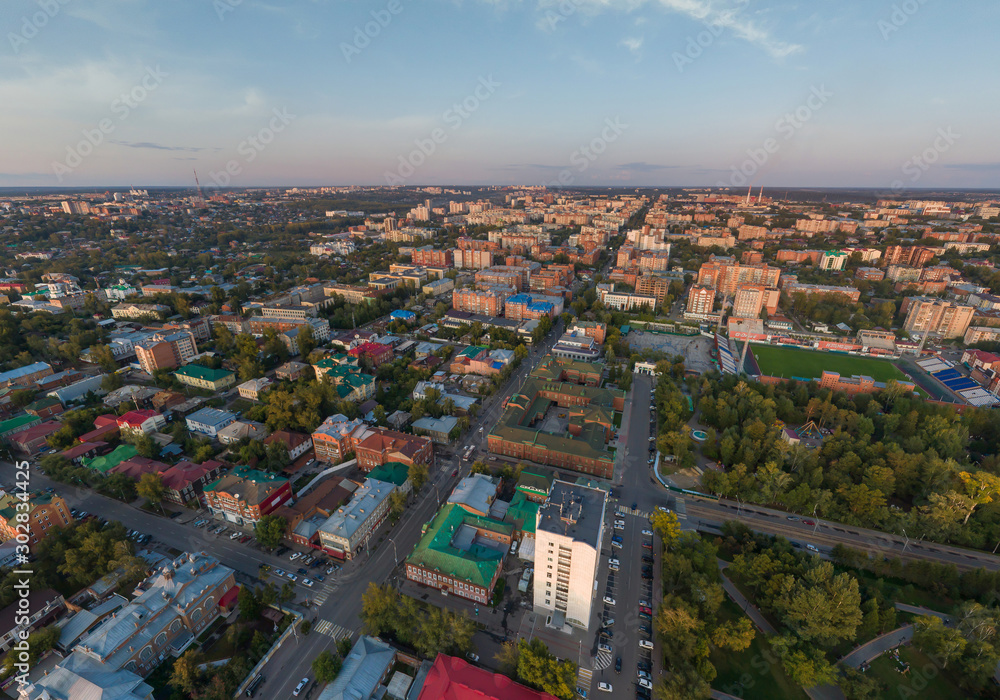 Obraz premium Aerial view of Tomsk city, Frunze Avenue, stadium. Russia. Summer, evening, sunset