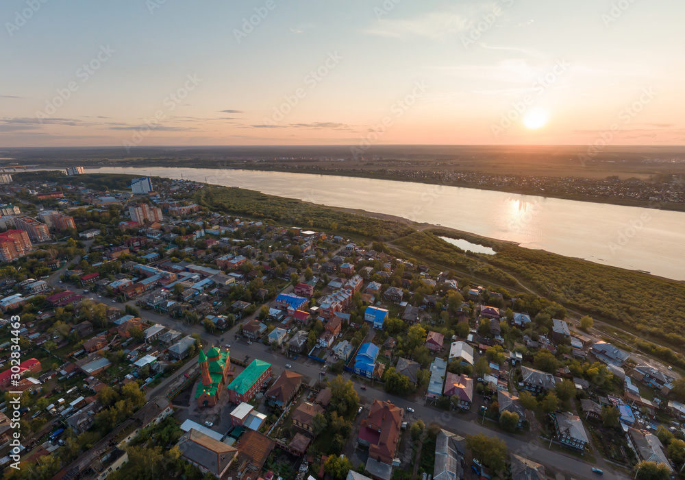 Aerial view of Tomsk city and Tom river, Red Cathedral Mosque, Russia. Summer, evening, sunset