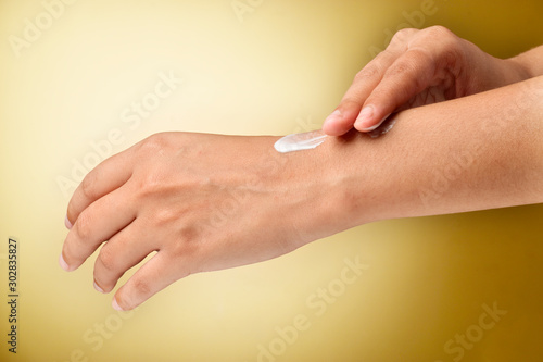 cream applying on hand, moisturizer apply on hands 