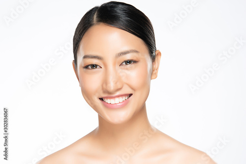 Beautiful smiling women with clean skin, natural make-up, and white teeth on white background.