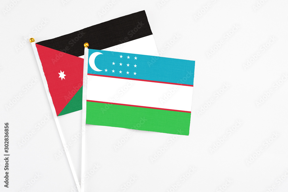 Uzbekistan and Jordan stick flags on white background. High quality fabric, miniature national flag. Peaceful global floor for copy space. Stock Photo | Adobe Stock