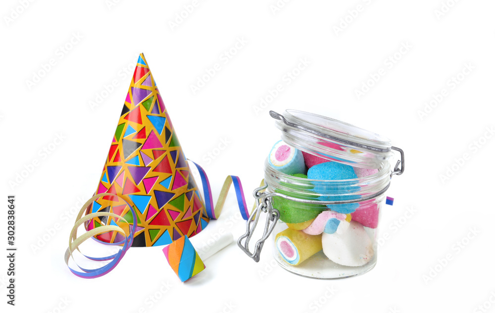 colorful marshmallows on a glass jar with favors party on white background
