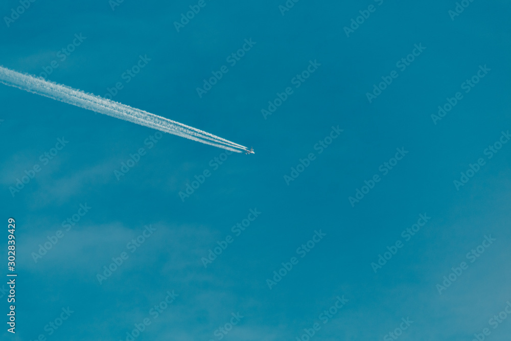 View of the condensation trails of airplane in the sky View of the condensation trails of airplane in the sky