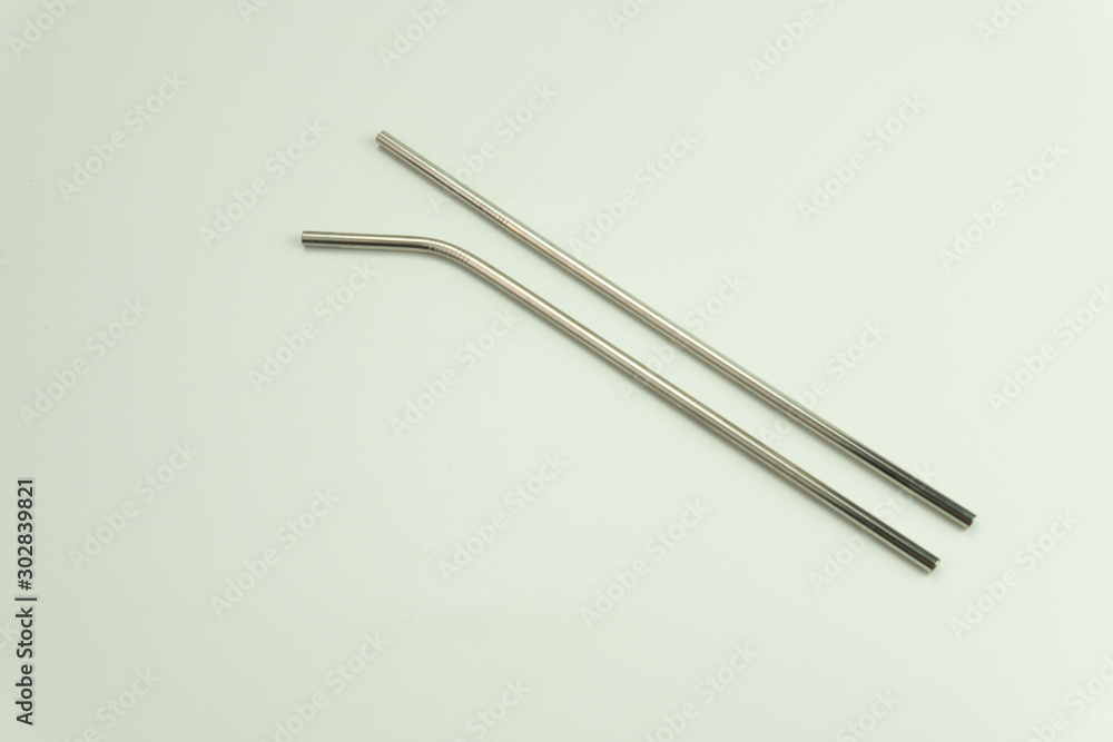 Selective focus of stainless steel drinking straw replacement for plastic straw. Save earth awareness. Selective focus of stainless steel drinking straw replacement for plastic straw. Save earth awareness.