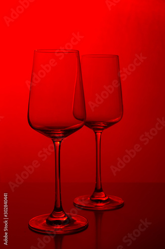 Rose wine in the glass at white background, romantic and elegant wine photo with copy space