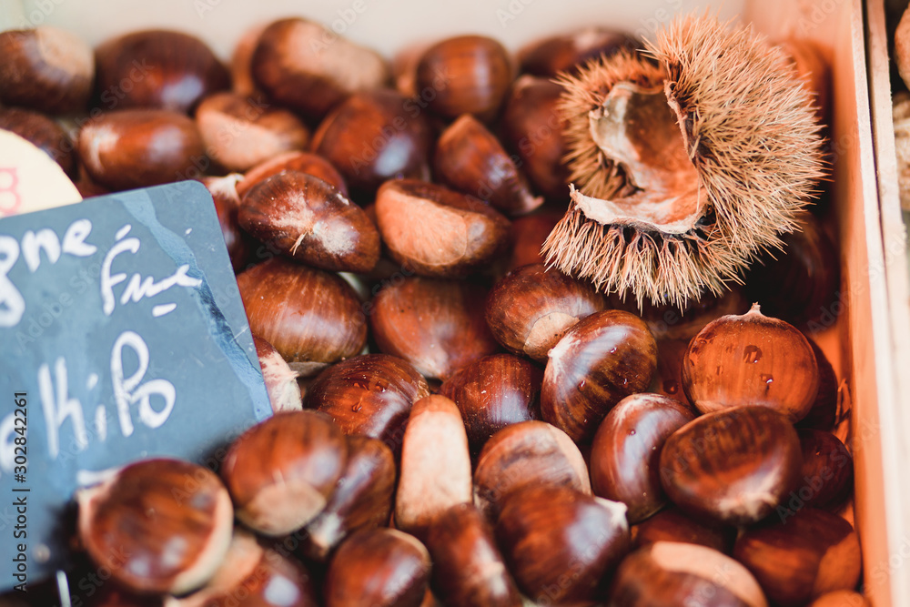 Food chestnuts on the counter - traditional tasty treat - roasted chestnuts Food chestnuts on the counter - traditional tasty treat - roasted chestnuts