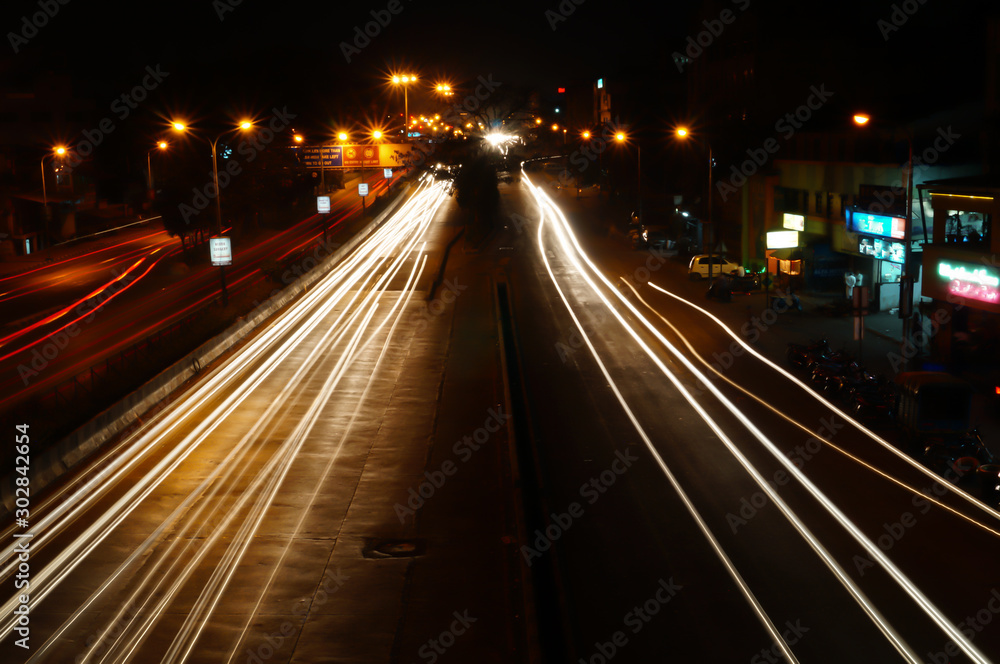 Vector image of colorful light trails with motion blur effect, long time exposure.