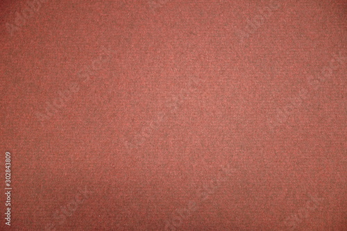 antique colored paper background texture with dark in old distressed vintage design. Colour of paper pink, christmas texture