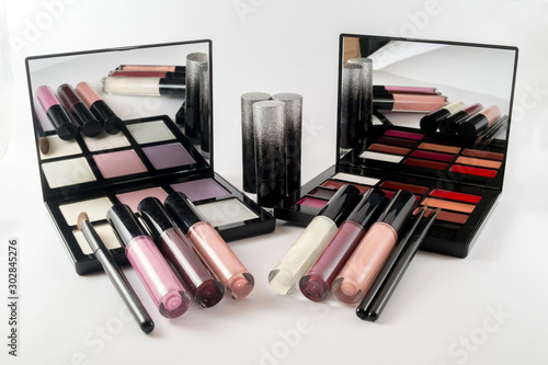 Different luxury makeup products on white background isolated.