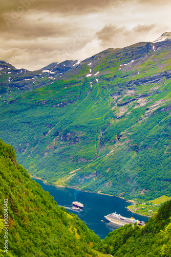 Fjord Geirangerfjord with ferry boat, Norway.