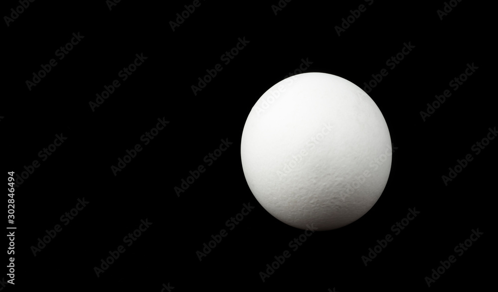 round white egg isolated on black background round white egg isolated on black background