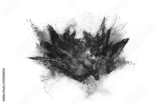 particles of charcoal on white background,abstract powder splatted on white background,Freeze motion of black powder exploding or throwing black powder.