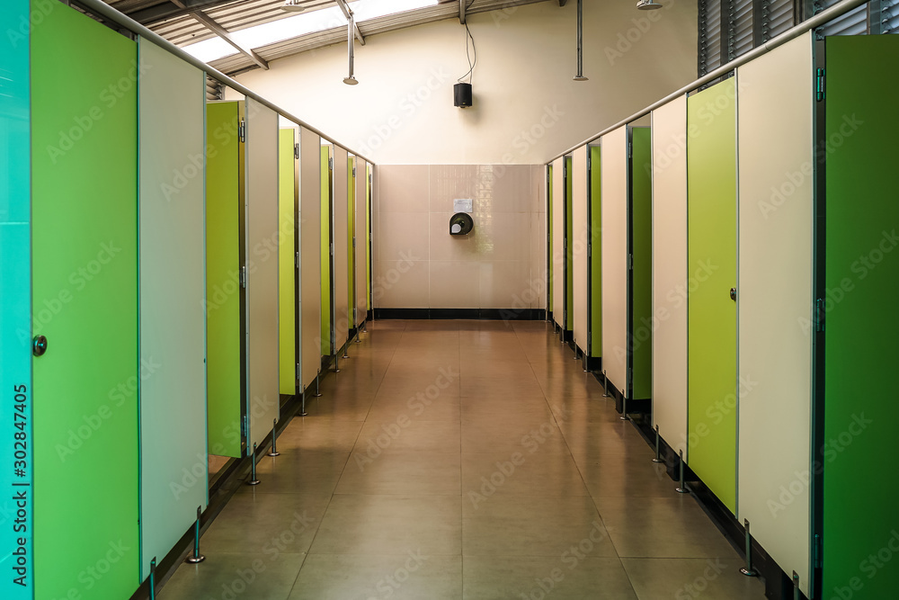 Interior of Thai style public restroom in gas station with white wall