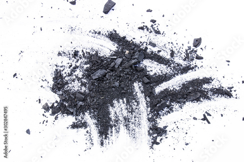 Black coal dust powder isolated on a white background
