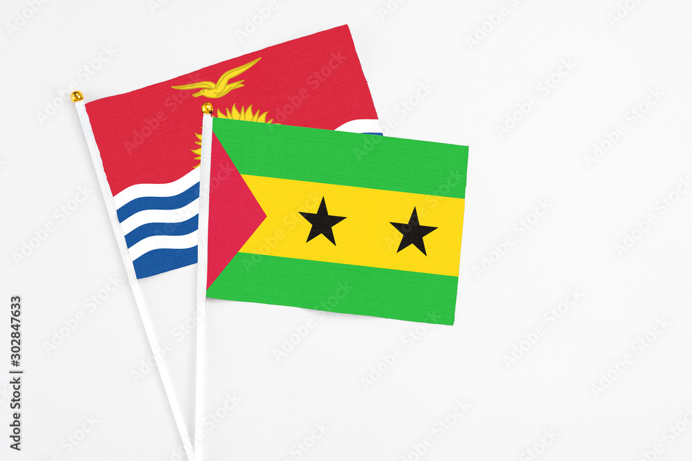 Sao Tome And Principe and Kiribati stick flags on white background. High quality fabric, miniature national flag. Peaceful global concept.White floor for copy space. Sao Tome And Principe and Kiribati stick flags on white background. High quality fabric, miniature national flag. Peaceful global concept.White floor for copy space.
