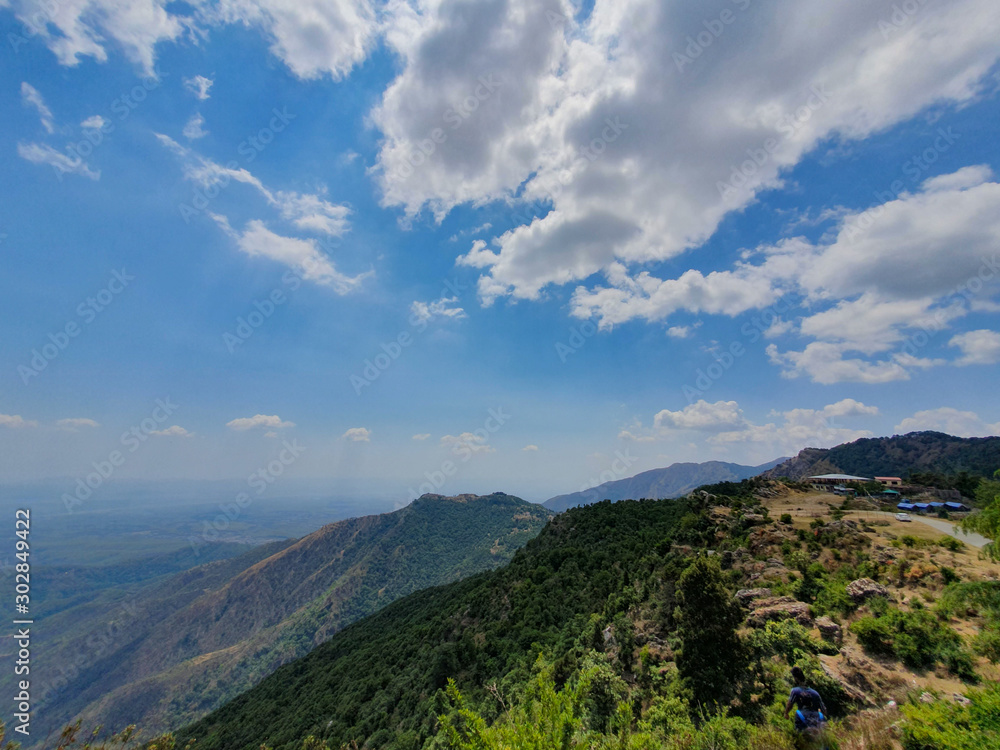 mountains of Himalayas in India beautiful midday sunny view with pretty clouds