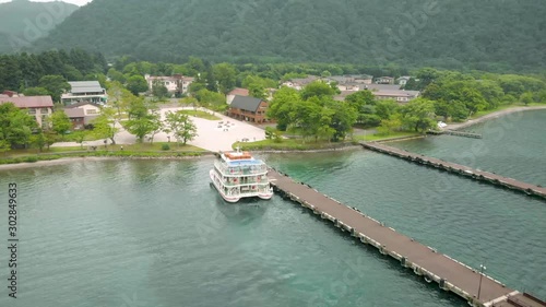 Wallpaper Mural Dolly shot for a ferry close to the pier with mountain view Torontodigital.ca
