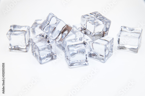Ice cubes square with drops water clean on white background