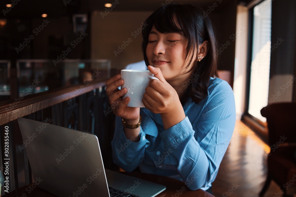 young woman with laptop in cafe young woman with laptop in cafe