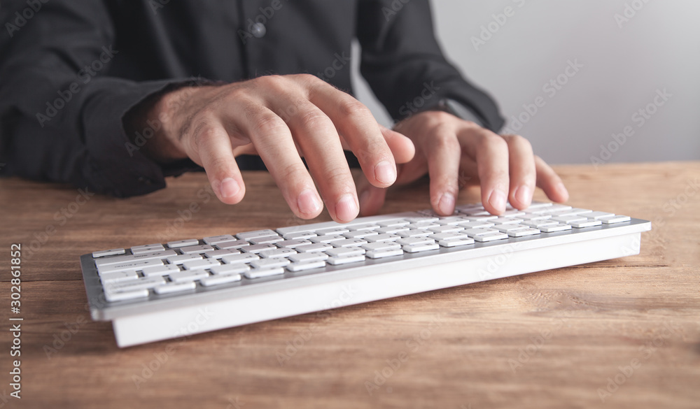Businessman typing on computer keyboard. Businessman typing on computer keyboard.