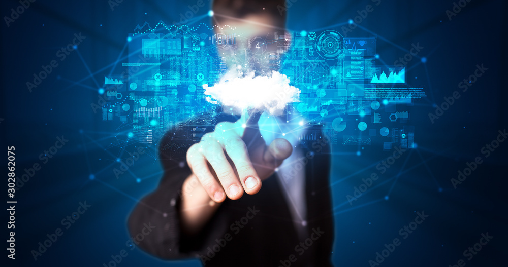 Man touching hologram projection displaying information from cloud based system Man touching hologram projection displaying information from cloud based system
