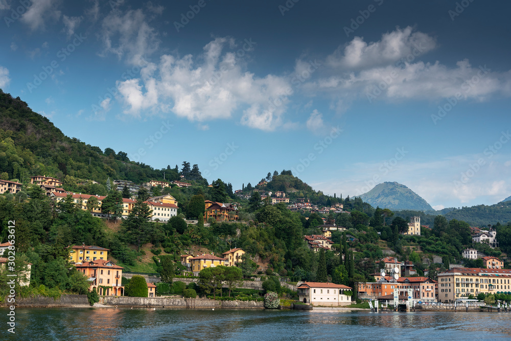 Como lake coasts in hot summer morning, Lombardy, Italy.