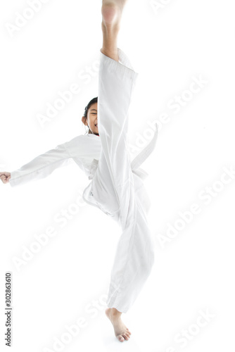 Asian taekwondo girl on with background.