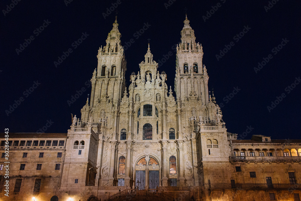 Santiago de Compostela, Spain - 10/18/2018: Cathedral of Saint James with illumination on dark sky in Santiago de Compostela. Cathedral on Camino de Santiago in the night. 