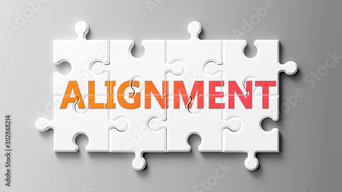Alignment complex like a puzzle - pictured as word Alignment on a puzzle pieces to show that Alignment can be difficult and needs cooperating pieces that fit together, 3d illustration