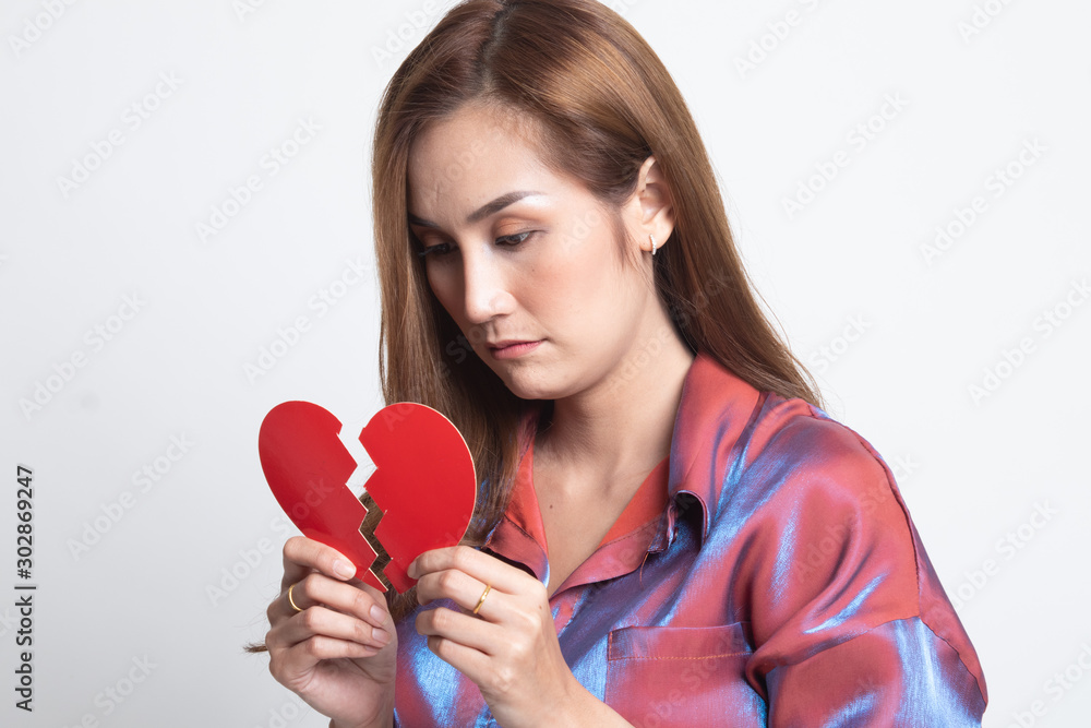 Beautiful young Asian woman with broken heart. Beautiful young Asian woman with broken heart.