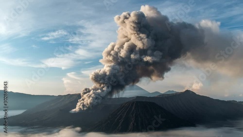 Becoming of Bromo Volcano eruption at sunset, Java Island, Indonesia