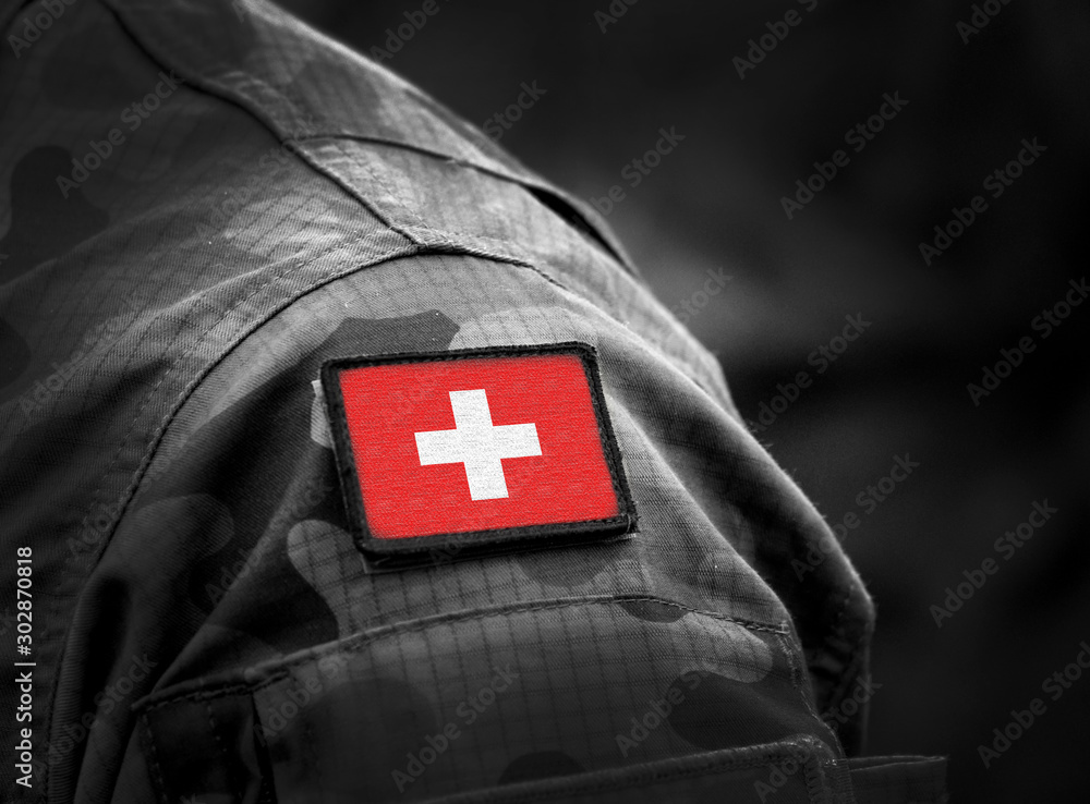 Flag of Switzerland on military uniform. Swiss flag on soldiers arm. Armed Forces, Army. Collage. - obrazy, fototapety, plakaty 