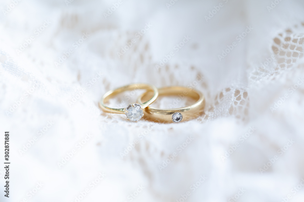 Diamond rings on white lace wedding dress Diamond rings on white lace wedding dress
