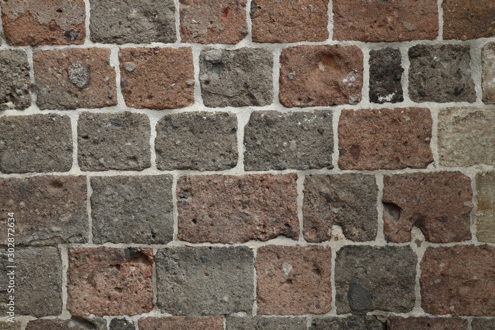 .Old brick wall. Stone background.