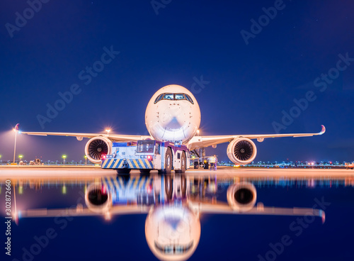 aircraft ready to departure with reflection photo