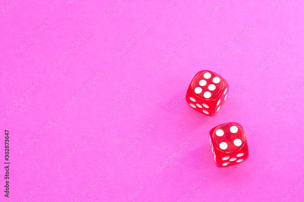 Gambling dices on a pink background. Gambling dices on a pink background.