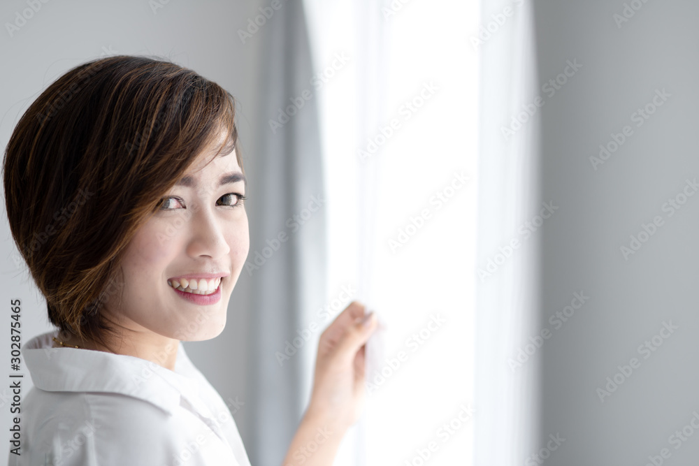 Beautiful woman with white curtain with natural light. Beautiful woman with white curtain with natural light.