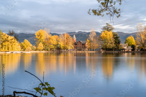 lake of Puigcerda AND SCHIERBECK PARK, town in Girona, Catalonia, in the midst of gardens rich in willows, conifers and other essences, the shores of this man-made lake are lined in pretty villas