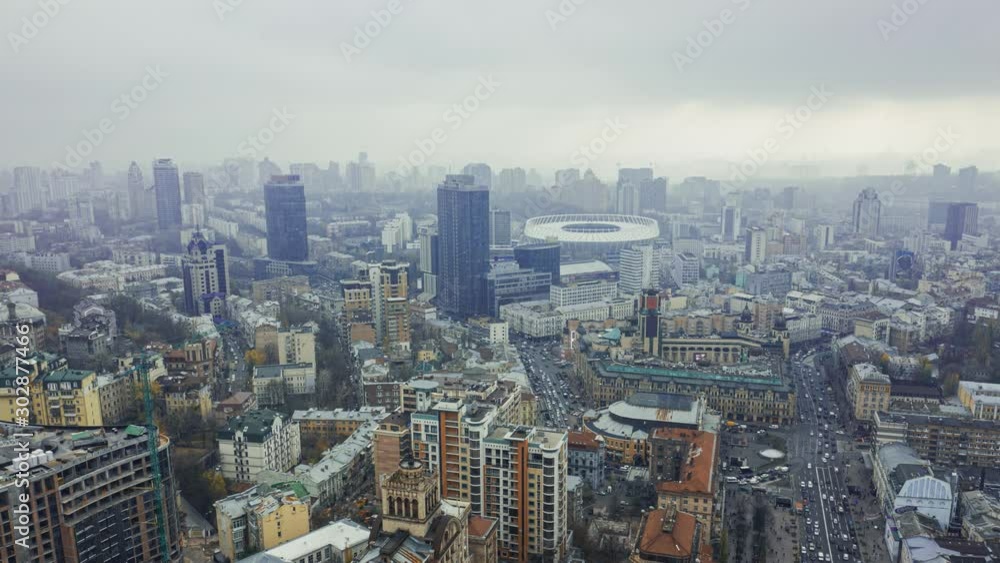 Aerial panoramic view of cityscape of Kiev during overcast. Cloudy weather in the capital of Ukraine. Business district skyscrapers stadium in background 4k Aerial panoramic view of cityscape of Kiev during overcast. Cloudy weather in the capital of Ukraine. Business district skyscrapers stadium in background 4k