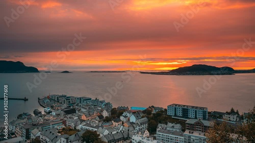 Alesund, Norway. Amazing Natural Bright Dramatic Sky In Warm Colours Above Alesund Valderoya And Islands In Sunset Time. Colorful Sky Background. Beauty In Norwegian Nature. 4K photo