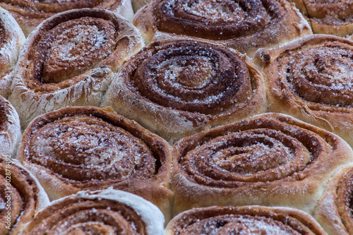 Fresh Sweet Homemade Cinnamon Rolls. Horizontal top view. Close up. Delicious Coffee Muffins. 