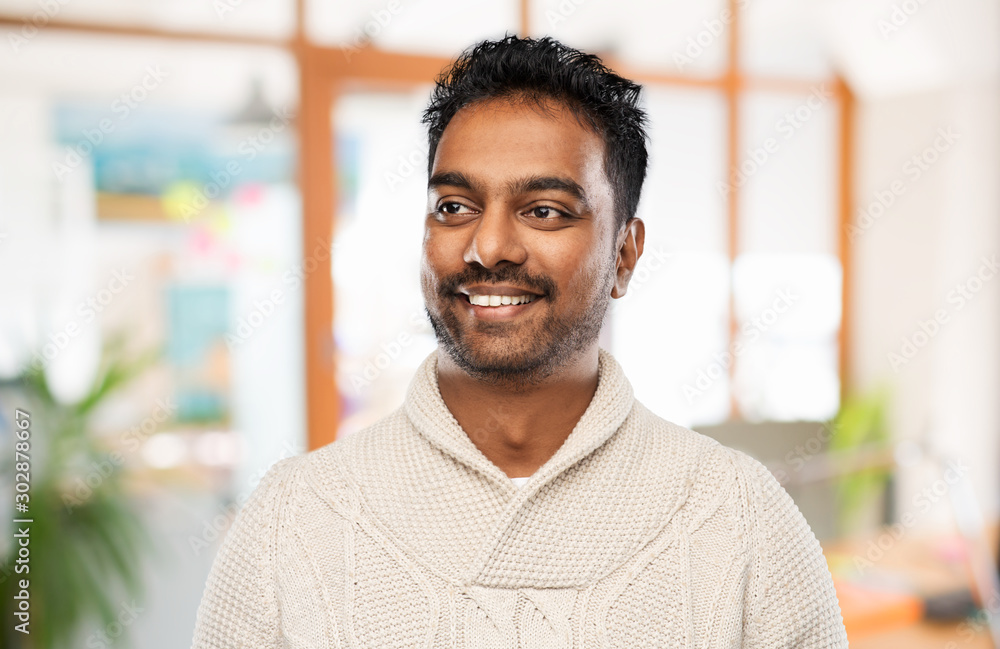 emotion, expression and people concept - smiling indian man in knitted woolen sweater over office background emotion, expression and people concept - smiling indian man in knitted woolen sweater over office background