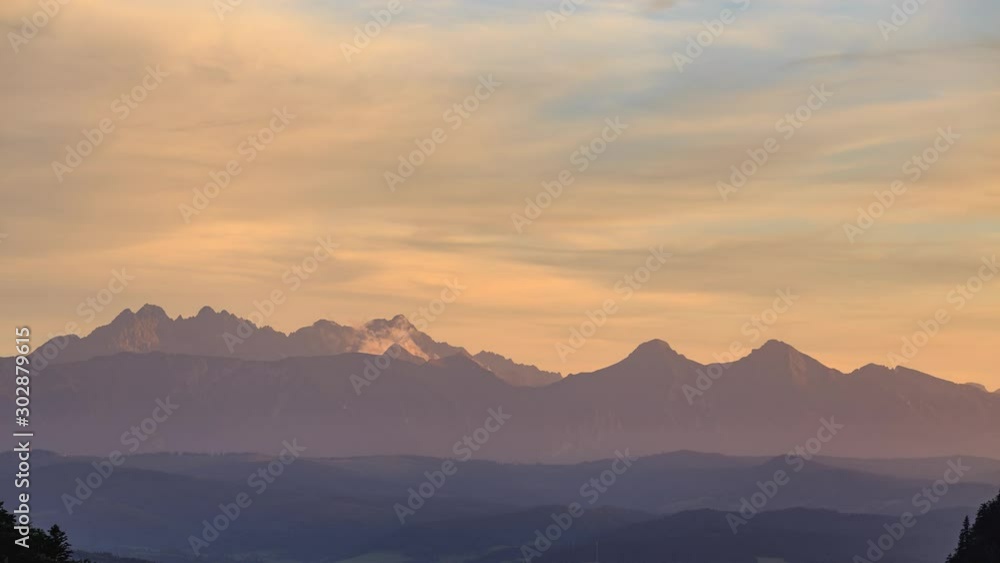 Sun setting over Tatra mountains seen from Sokolica in Pieniny. Sun setting over Tatra mountains seen from Sokolica in Pieniny.
