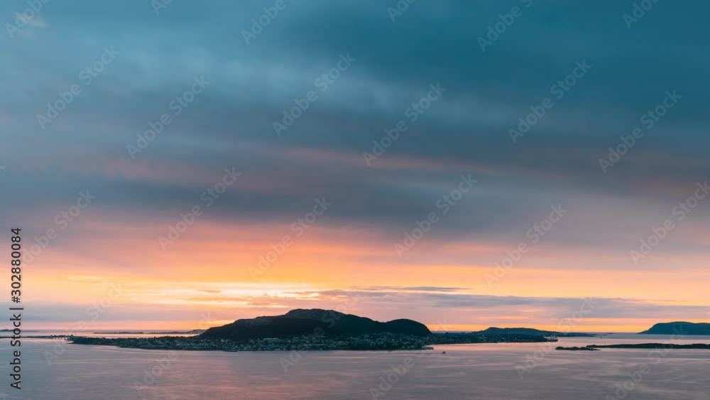 Alesund, Norway. Amazing Natural Bright Dramatic Sky In Warm Colours Above Alesund Valderoya And Islands In Sunset Time. Colorful Sky Background. Beauty In Norwegian Nature. 4K