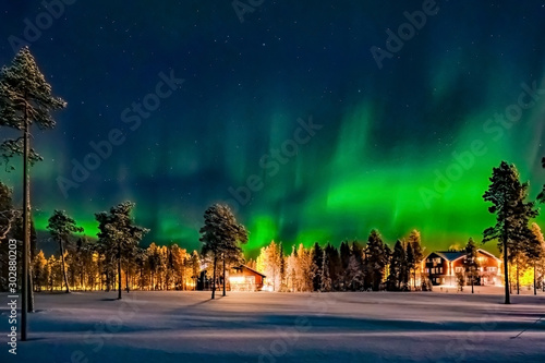 Aurora borealis (also known like northern or polar lights) beyond the Arctic Circle in winter Lapland.